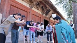Guests on the “Discovering Shanxi’s Ancient Chinese Architecture” tour practice the Tang-style hand-over-chest salute at Foguang Temple in Xinzhou.